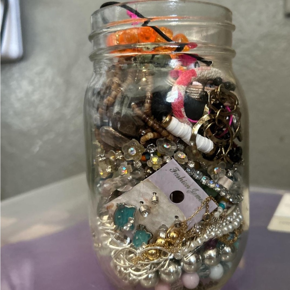 Mystery jar with necklaces, earrings, rings, and more